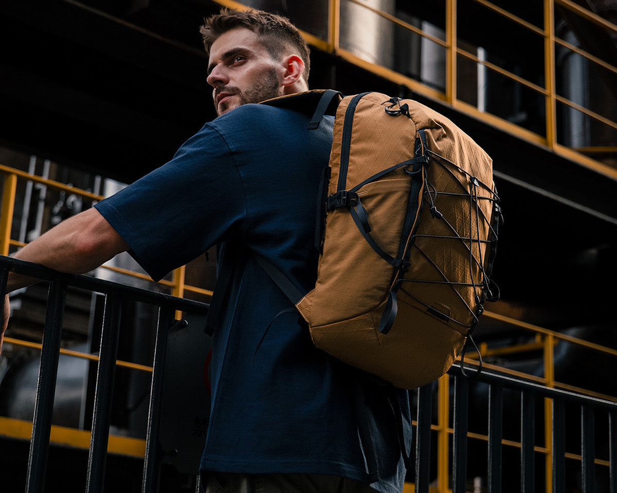 ReeYee A3 26L city-to-trail backpack worn during an urban commute